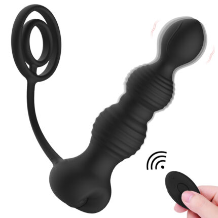 a black silicone anal toy with a unique design. It features a textured shaft with multiple bulbous sections for added stimulation. The toy is connected to a cock ring by a flexible strap, providing additional functionality and support during use. A wireless remote control is included, allowing for easy adjustment of the toy's vibration settings, enhancing the overall experience. This product is designed to offer both internal and external stimulation, catering to various user preferences and providing a comprehensive and pleasurable experience.