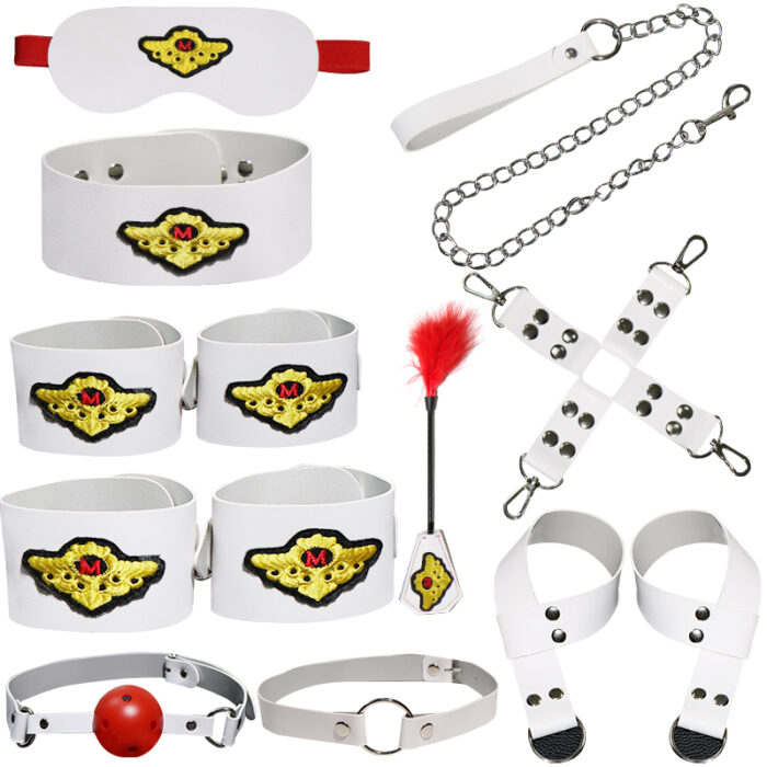 a set of white bondage accessories, including an eye mask, a collar, wrist and ankle cuffs, a ball gag, a feather tickler, and various connectors and chains. Each item is adorned with a distinctive yellow and black patch, adding a unique touch to the set. The accessories are designed to enhance sensory play and BDSM activities.