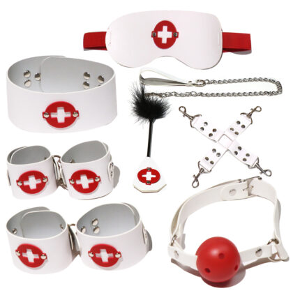 a collection of white and red BDSM accessories including handcuffs, a gag, and a flogger