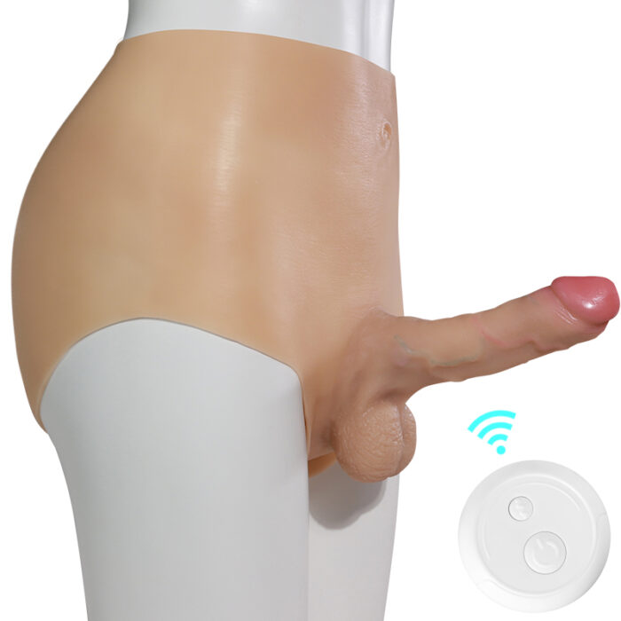 The Female Wearable Simulation Electric Retractable Penis Female Masturbator Lala Les Flocking Adult Sex Product is shown attached to a white mannequin torso, showcasing its realistic silicone construction and detailed genital features. Beside the prosthesis, there is a white, round remote control with buttons and a blue signal icon, indicating that the device can be controlled remotely.