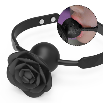 A black rose-shaped gag designed for BDSM play. The gag features an adjustable strap for a secure fit and a rose-shaped mouthpiece that adds a touch of elegance to the experience. The inset image shows the gag in use, highlighting its waterproof and durable design.