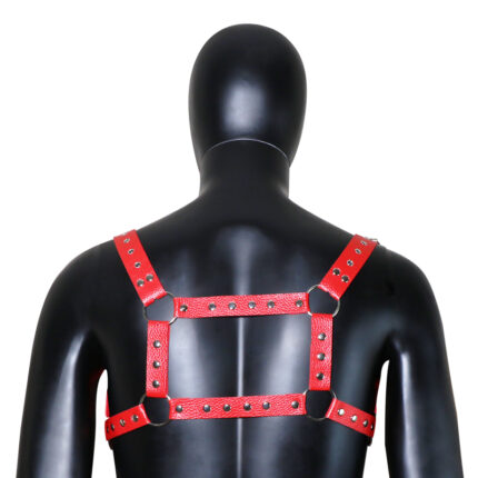 a red leather harness with metal studs, worn on a mannequin. The harness is designed in a square pattern across the back, with adjustable straps and metal rings for securing. It is intended for both aesthetic and functional purposes in BDSM activities, providing a bold and durable accessory for bondage play.