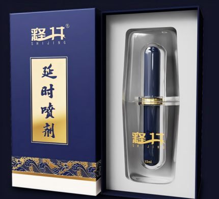 a SHIJING brand male delay spray. The packaging and spray bottle have a dark blue and gold design, giving it a very high-end and stylish appearance. The front of the box has the tagline “SUPER LONG AND LONG-LASTING,” emphasizing the product's long-lasting effect. There is also a note “NO SIDE EFFECTS AND SAFE,” indicating the product's safety. The spray bottle is elegantly designed with a clear outer casing and a dark blue inner bottle, with the brand logo printed on it. The overall design conveys the product's effectiveness and premium feel, making it suitable for male users who seek quality and performance.