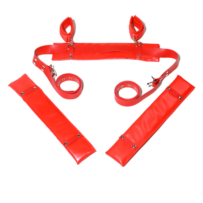 a set of red bondage restraints. The set includes padded wrist and ankle cuffs connected by adjustable straps, designed for secure and comfortable restraint during intimate activities. The bright red color adds a bold and daring touch to the set.