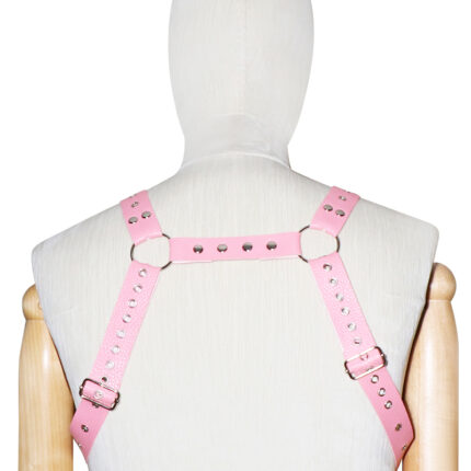 a pink leather harness with metal studs, worn on a mannequin. The harness is designed with adjustable straps and metal rings for securing, forming a rectangular pattern across the back. It is intended for both aesthetic and functional purposes in BDSM activities, providing a stylish and secure accessory for bondage play.