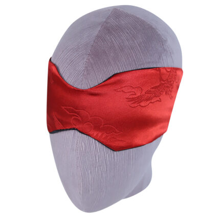 a red satin blindfold with intricate embroidered designs. The blindfold is displayed on a mannequin head, showcasing its elegant and luxurious appearance. The smooth satin fabric and detailed embroidery add a touch of sophistication, making it a stylish accessory for sensory play and intimate experiences.