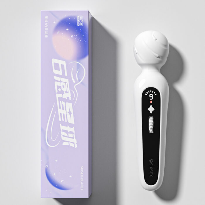 A white handheld massager with a rounded head and black control panel, shown next to its purple box packaging. The packaging features white text and an abstract design.