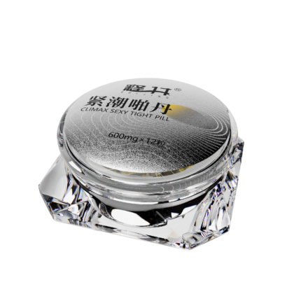 a product from the SHIJING brand called "Climax Sexy Tight Pill." The container is elegantly designed with a clear crystal material, giving it a luxurious and sophisticated appearance. The top of the container is labeled with the product name and specifications, "600mg x 12 pills," and includes silver and gold detailing. The overall design is very stylish and high-end, highlighting the product's luxurious quality and effectiveness.