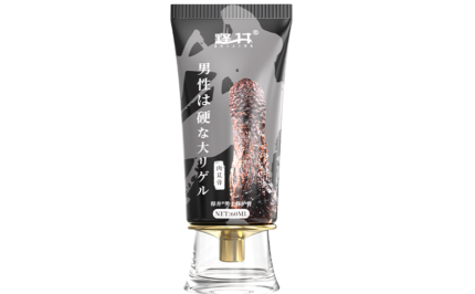 The image shows a black tube with gold and white lettering, similar to the previous one, but with a different design. This product appears to be a gel specifically designed for men, as indicated by the text and the image of a phallic shape on the front. The tube has a transparent base with a gold cap, adding a touch of elegance to the packaging. The text on the tube is in Japanese.