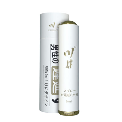 a male product with a simple and high-end design. The packaging is primarily white with gold text and details, giving it a luxurious and professional appearance. The bottle is printed with the brand name and product information, and the packaging box also displays the same brand logo and product description, highlighting its main functions and usage instructions. The overall design looks very refined and high-quality, suitable for male users who value effectiveness and attractive packaging