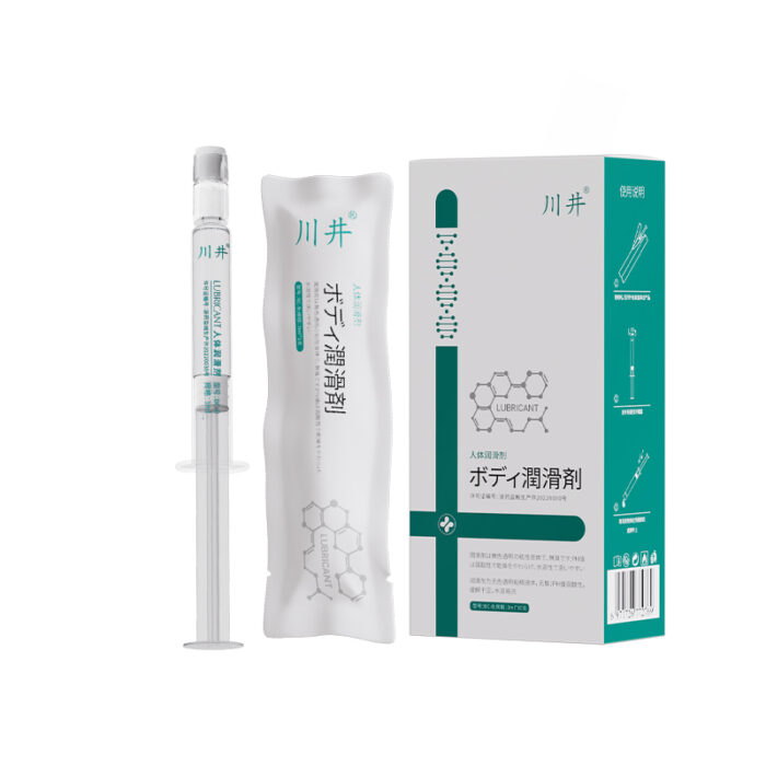 A syringe-like lubricant applicator in white and teal packaging, featuring a labeled box, a sealed packet, and a tube with a cap. The text is primarily in Japanese.