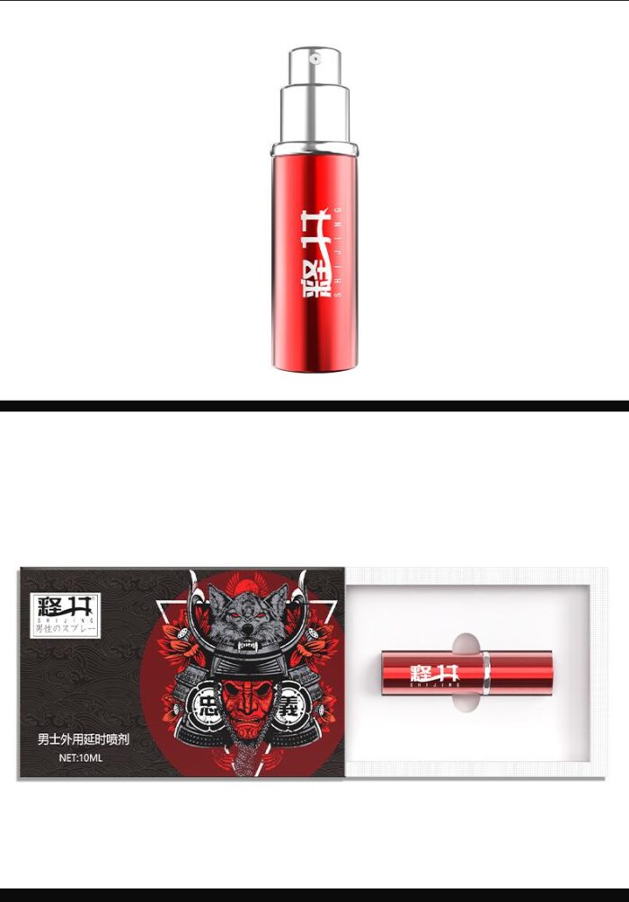 a SHIJING brand male delay spray. The packaging is designed in deep red, giving it a high-end and stylish appearance. The box features traditional Japanese warrior imagery, emphasizing the product's strength and quality. The front of the box has the tagline “ONE SPRAY DELAY, LONG BATTLE WITHOUT NUMBNESS,” highlighting its effectiveness. The spray bottle has a sleek red metallic design, simple yet elegant, with the brand logo and capacity information printed on it. The overall design conveys the product's efficiency and safety, making it suitable for quality-conscious users.